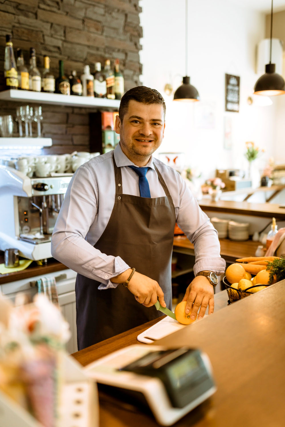 Bartender preparing fresh drinks at the Resto Bistro bar